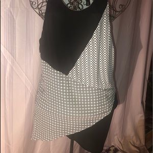Black and white sleeveless blouse.